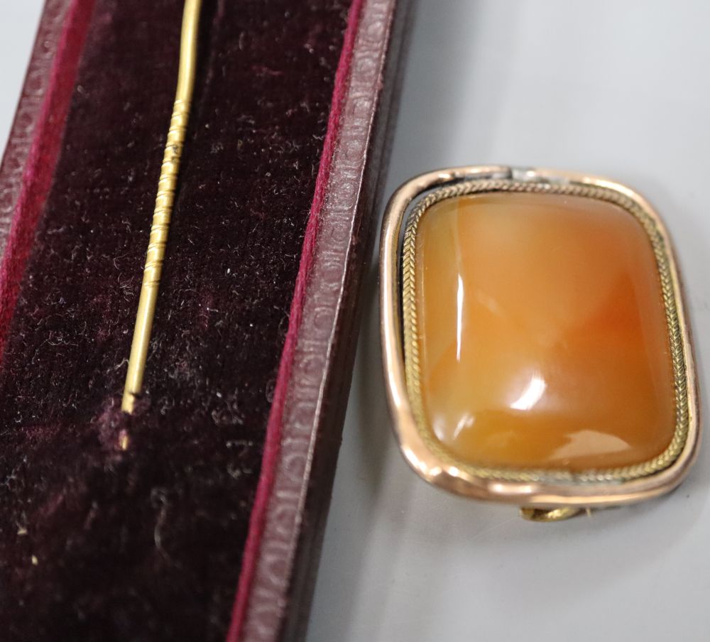 An early 20th century gold plate mounted propelling pencil, an agate set brooch, a 9ct gold and enamel medallion and a fox head pin.